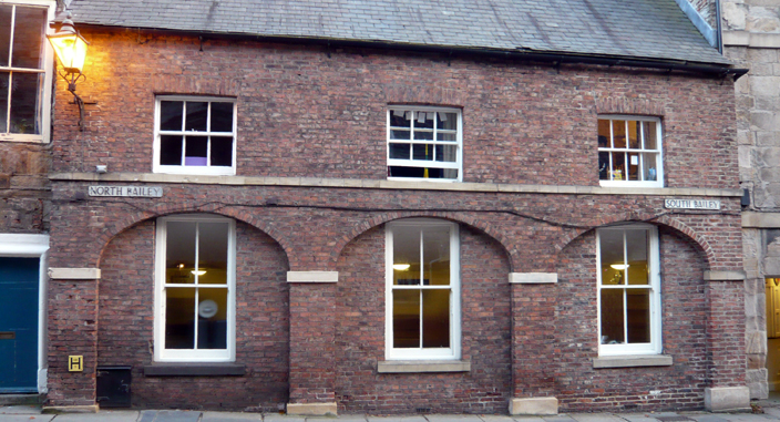 The old priory stables mark the boundary between North and South Bailey